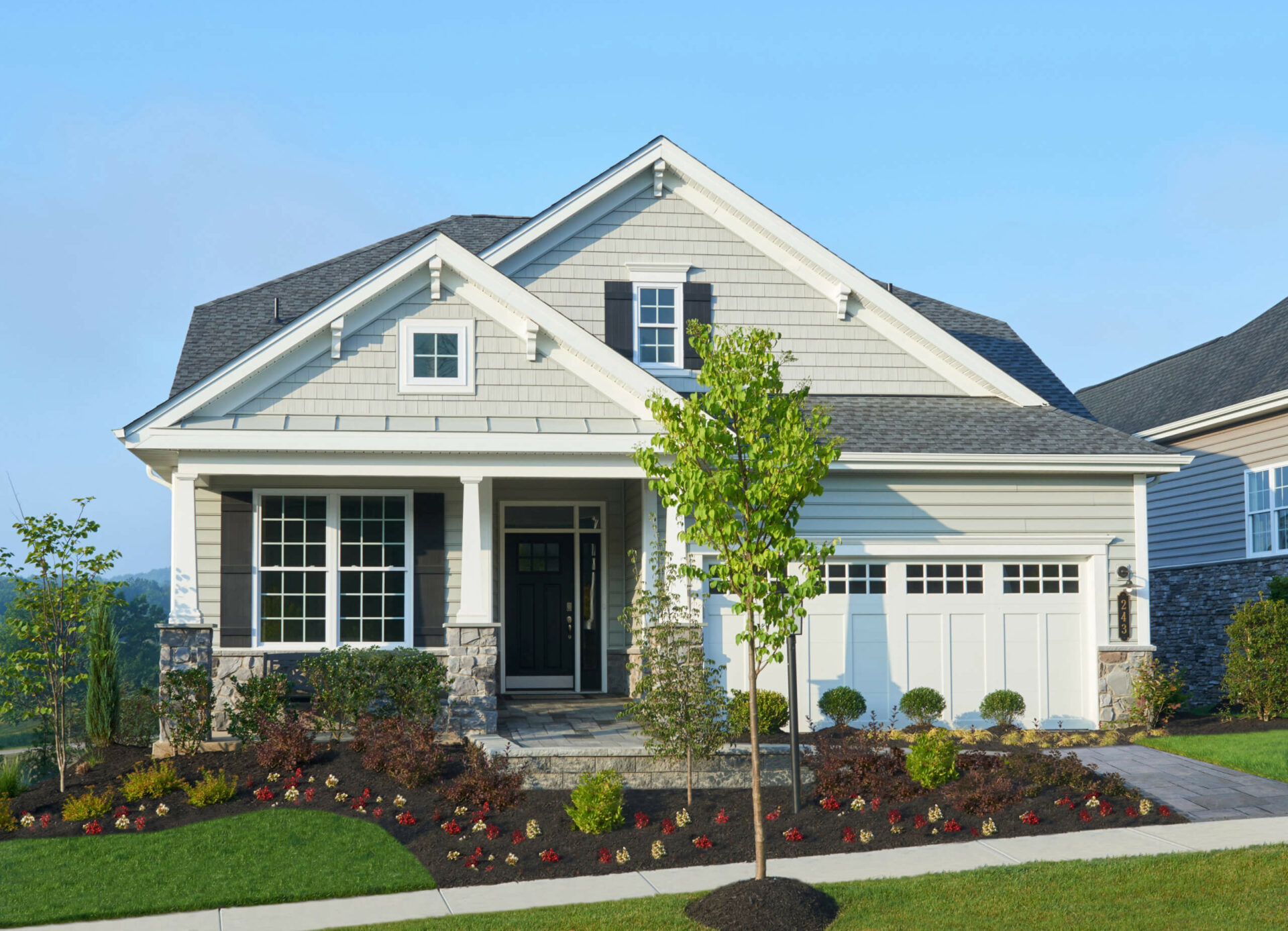 Front elevation of a white home from traditions of America