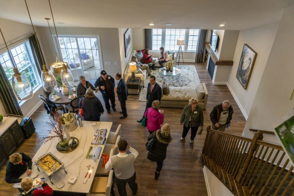 people touring a home from Traditions of America