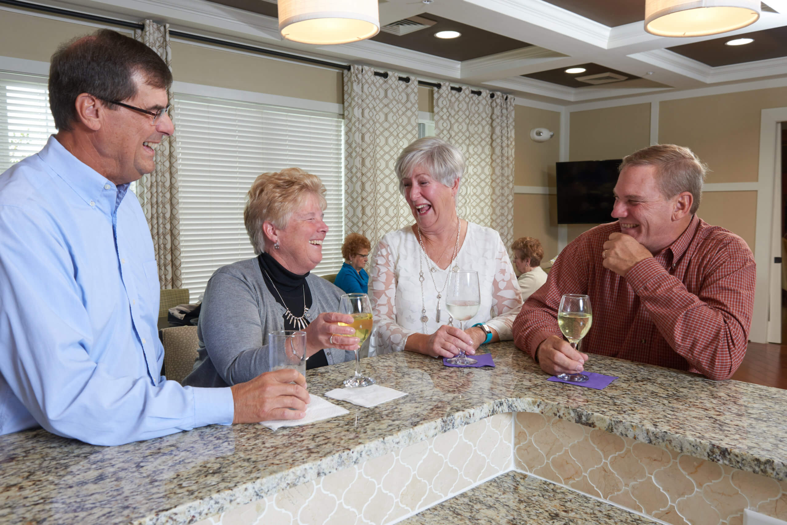 couples enjoying a wine tasting at Traditions of America