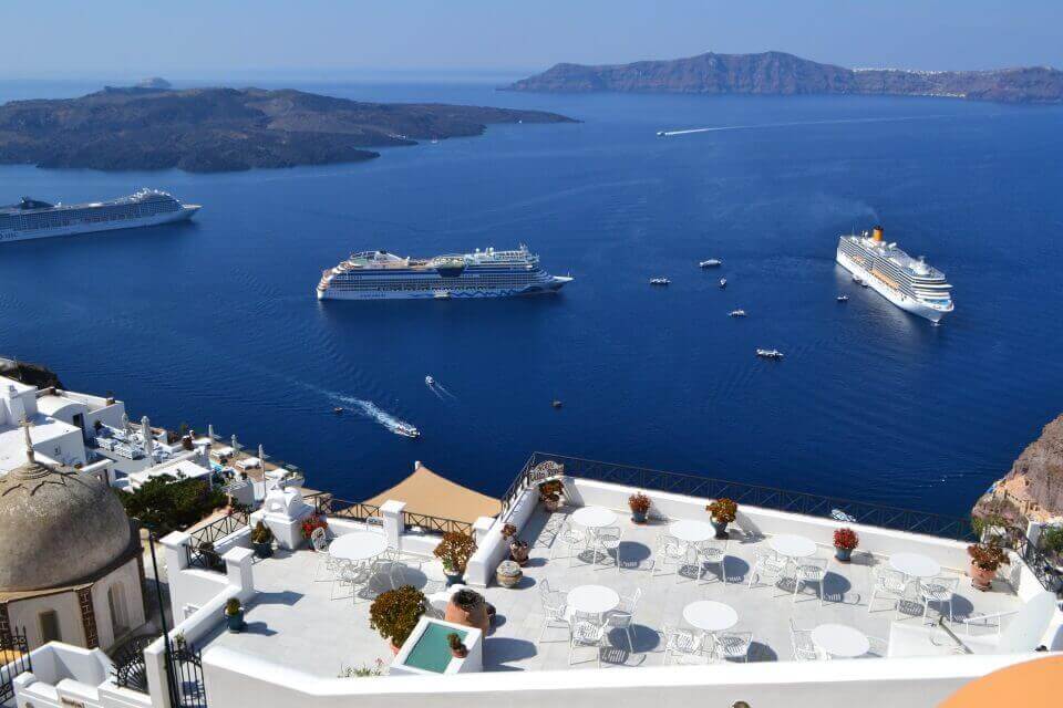 Photo of the ocean in greece with cruise ships on it