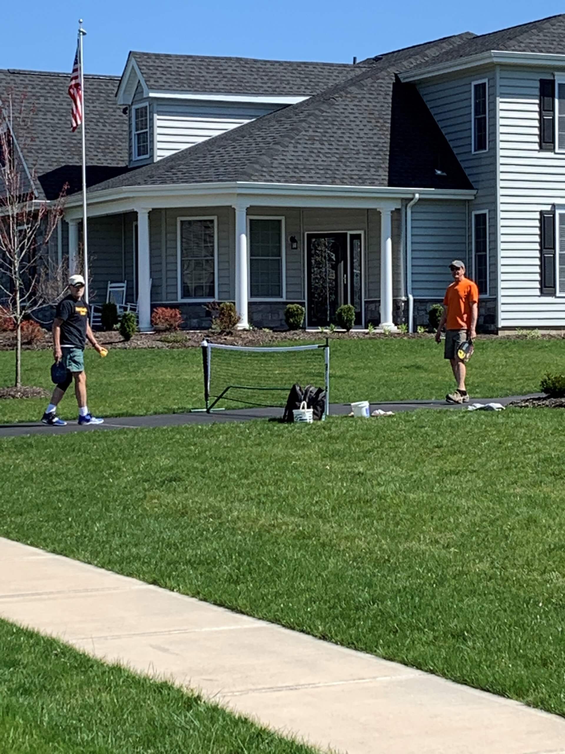 Two men enjoying a game of pickle ball 