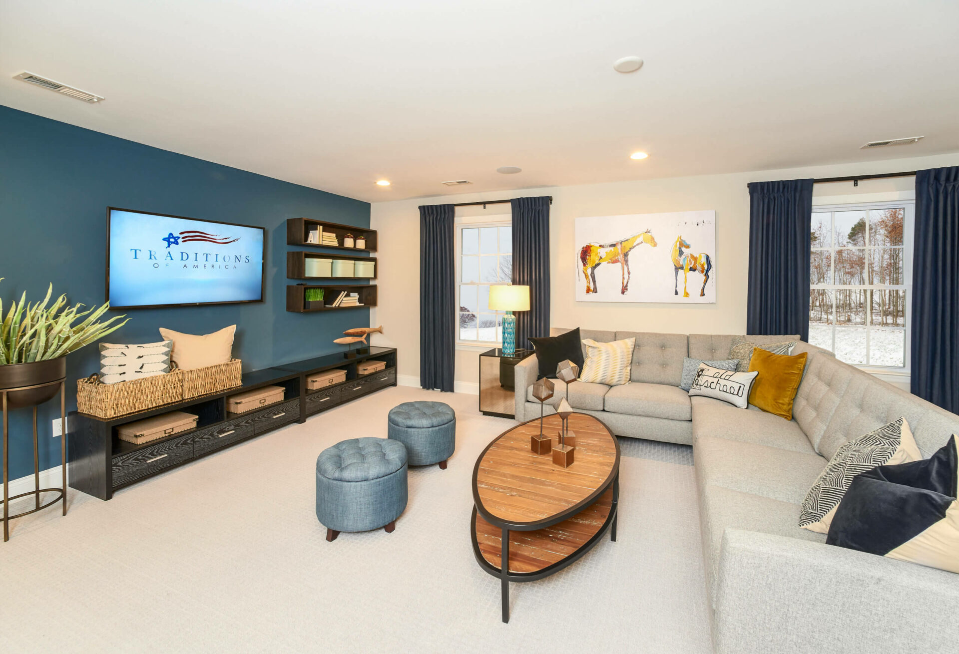 Living room with large sectional couch in a traditions of America home