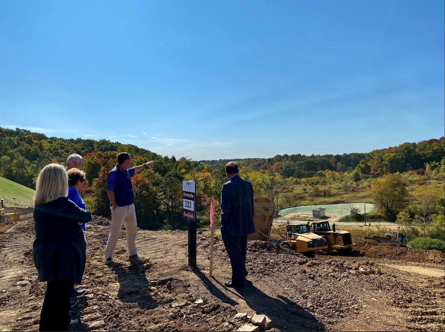 People exploring a homesite from Traditions of america