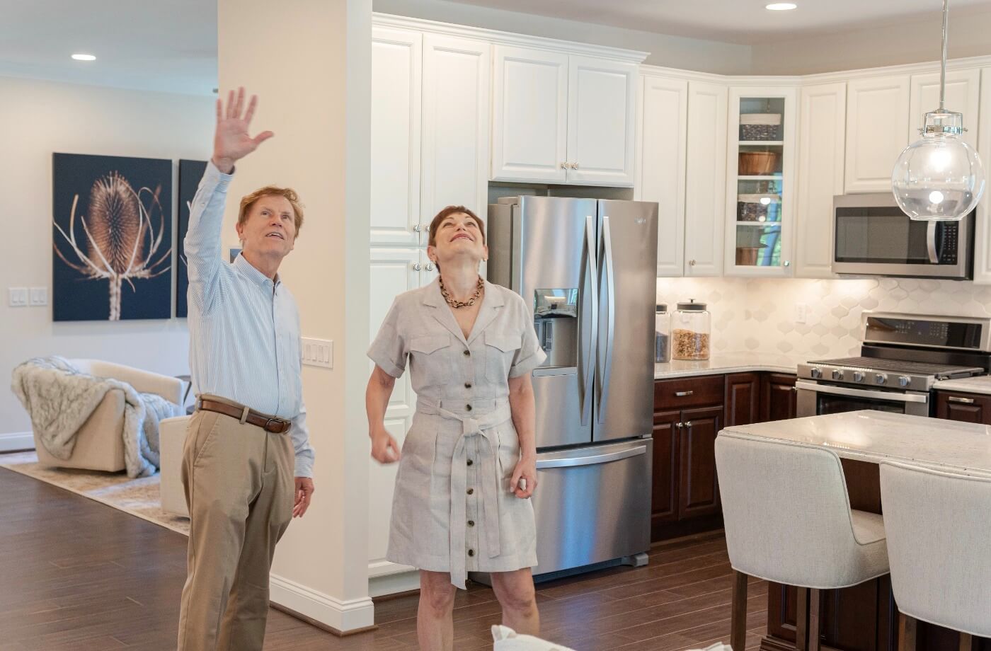 Two people looking around their new traditions of America new home