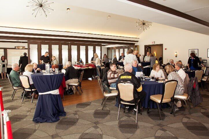 People enjoying a dinner from Traditions of America