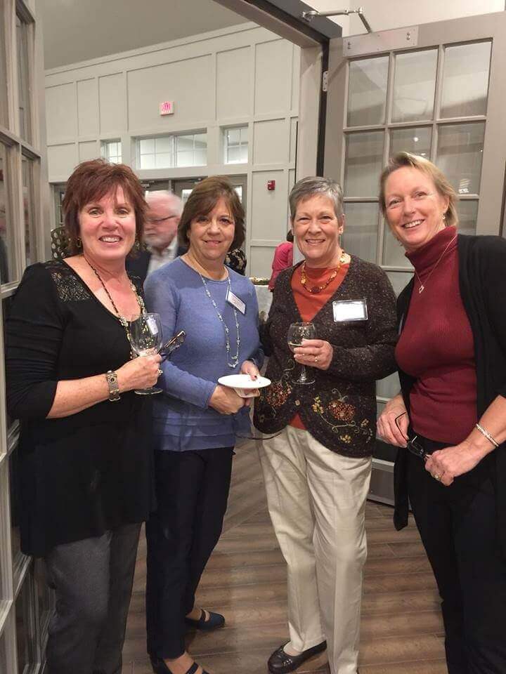 People posing for a photo at the friends giving from traditions of america