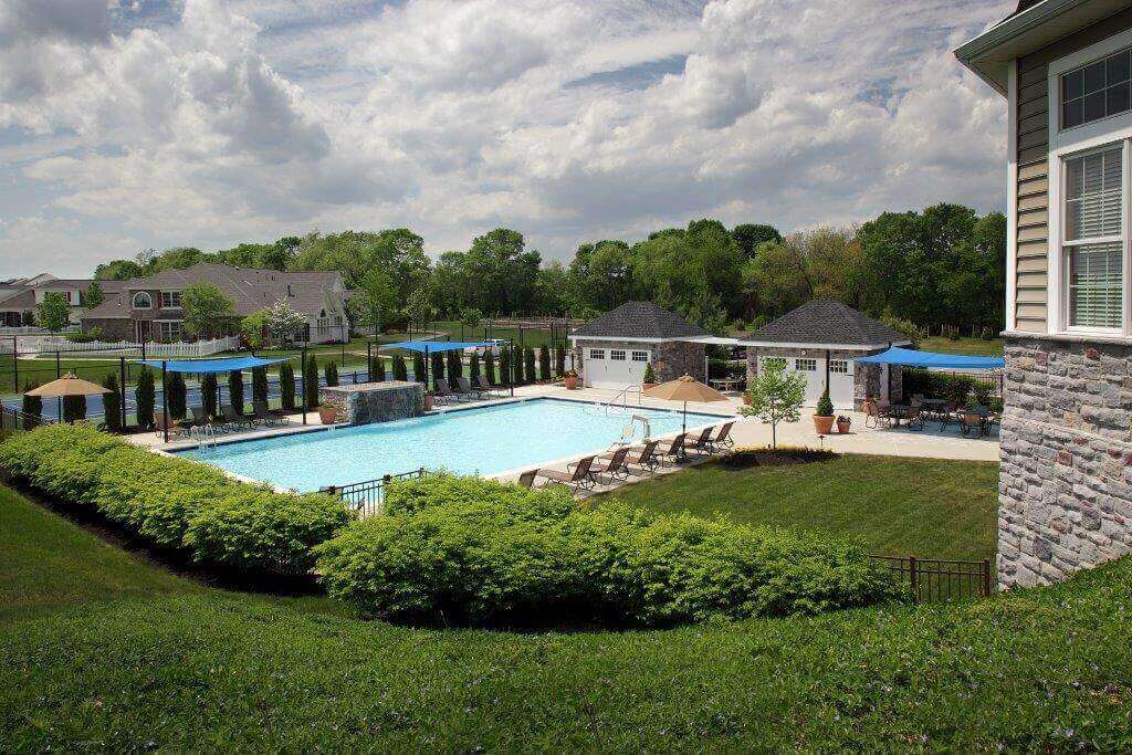 Pool outside the clubhouse of a Traditions of America community