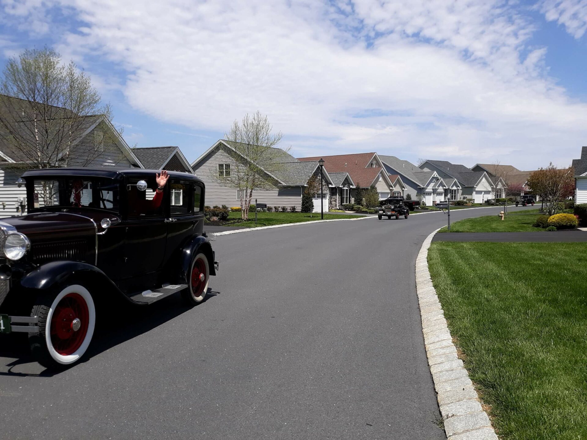 Old cars driving in a parade