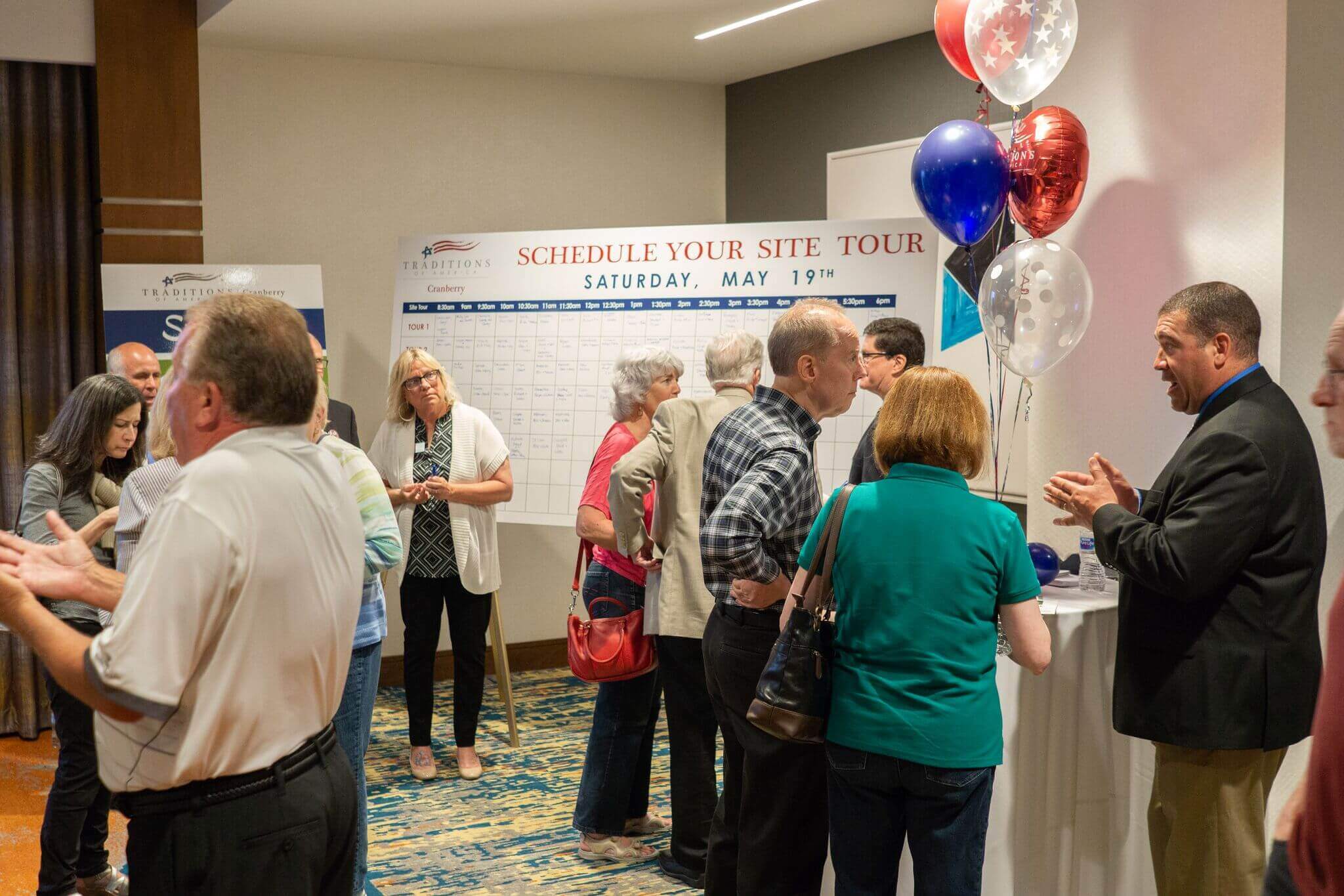 Dan, at far right, speaking to customers about the building process at Traditions of America- Active Adult Communities