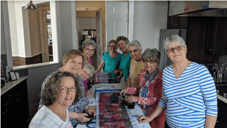 People hanging out in their traditions of America kitchen