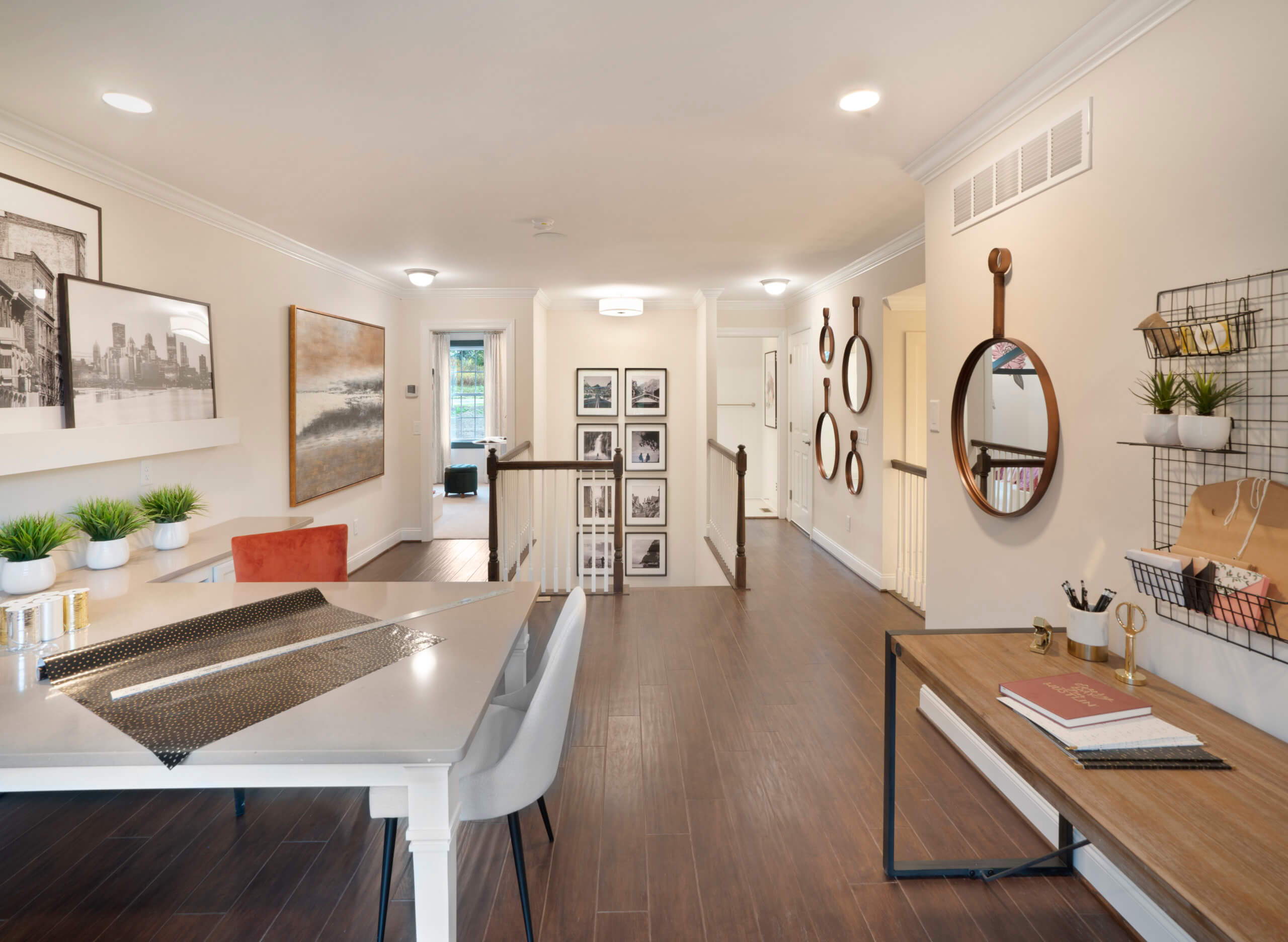 Loft area with desk and chairs from traditions of america