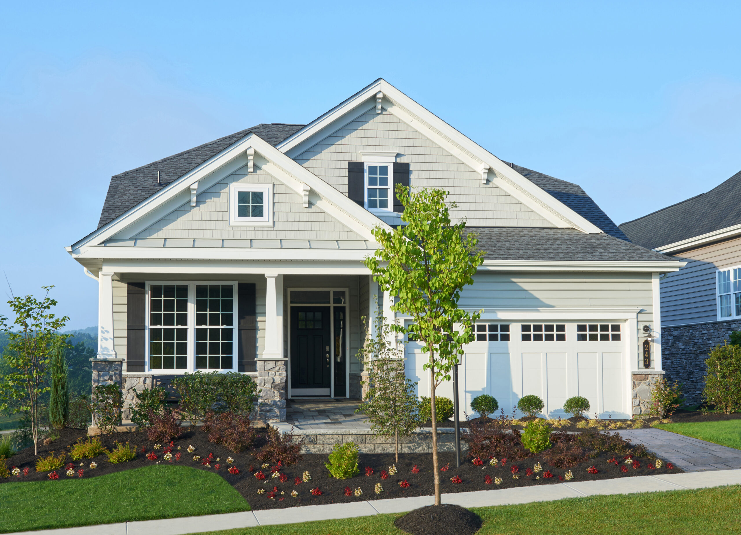 Front elevation of a white home from Traditions of America