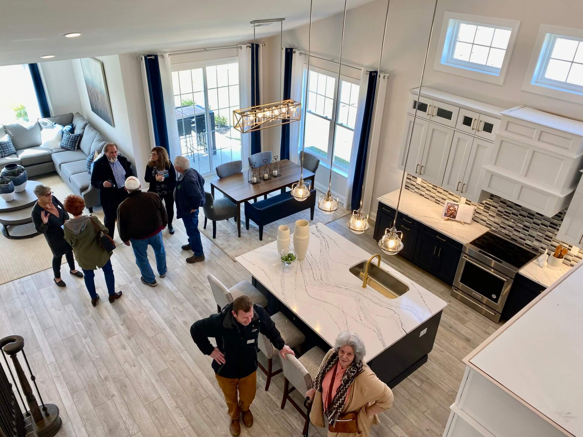 People standing in the kitchen from Traditions of America