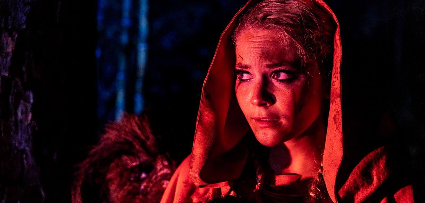 Woman dresses as little red riding hood at GrimmWoods at Kings Dominion