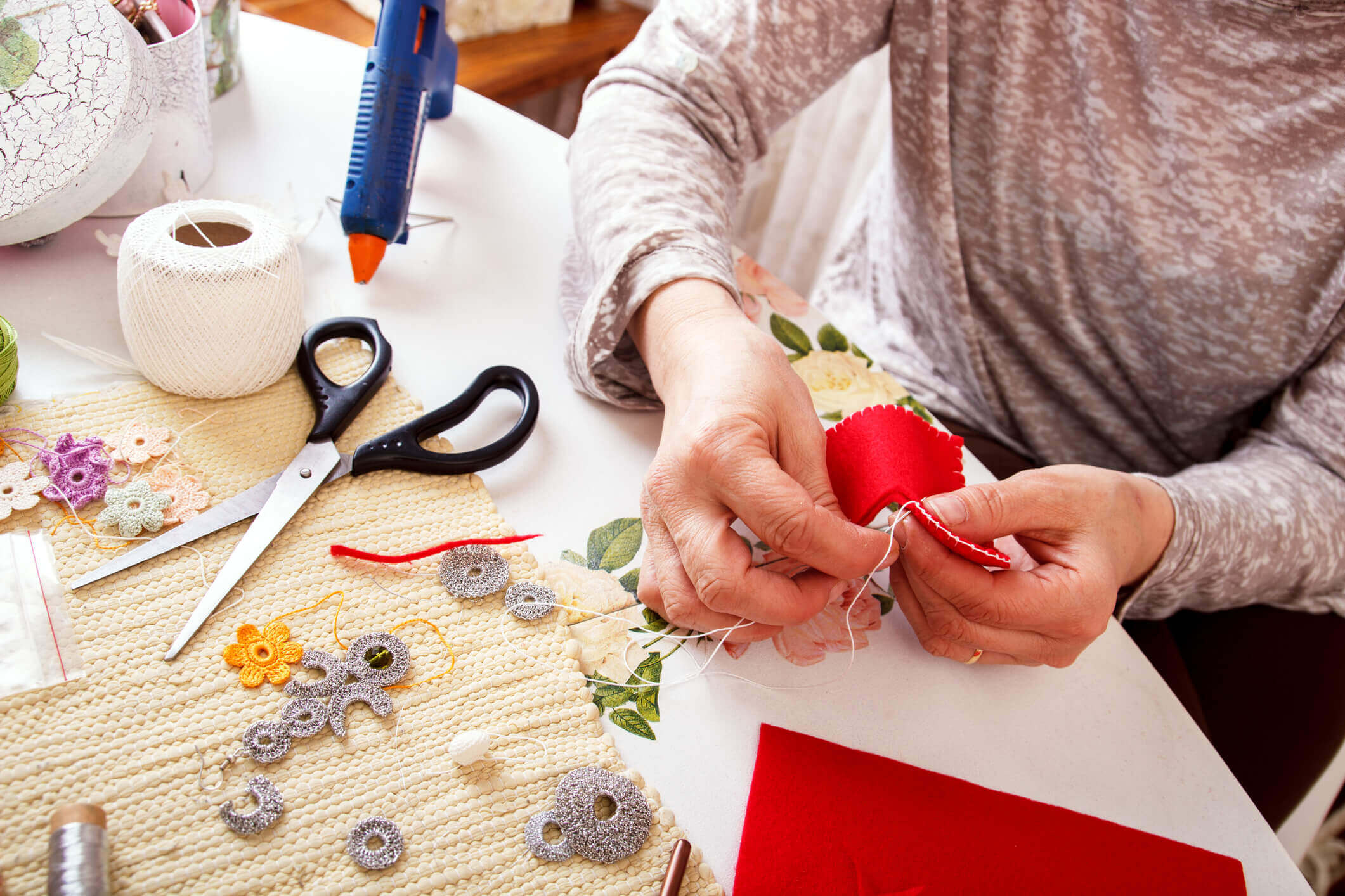 Person doing crafts at the table