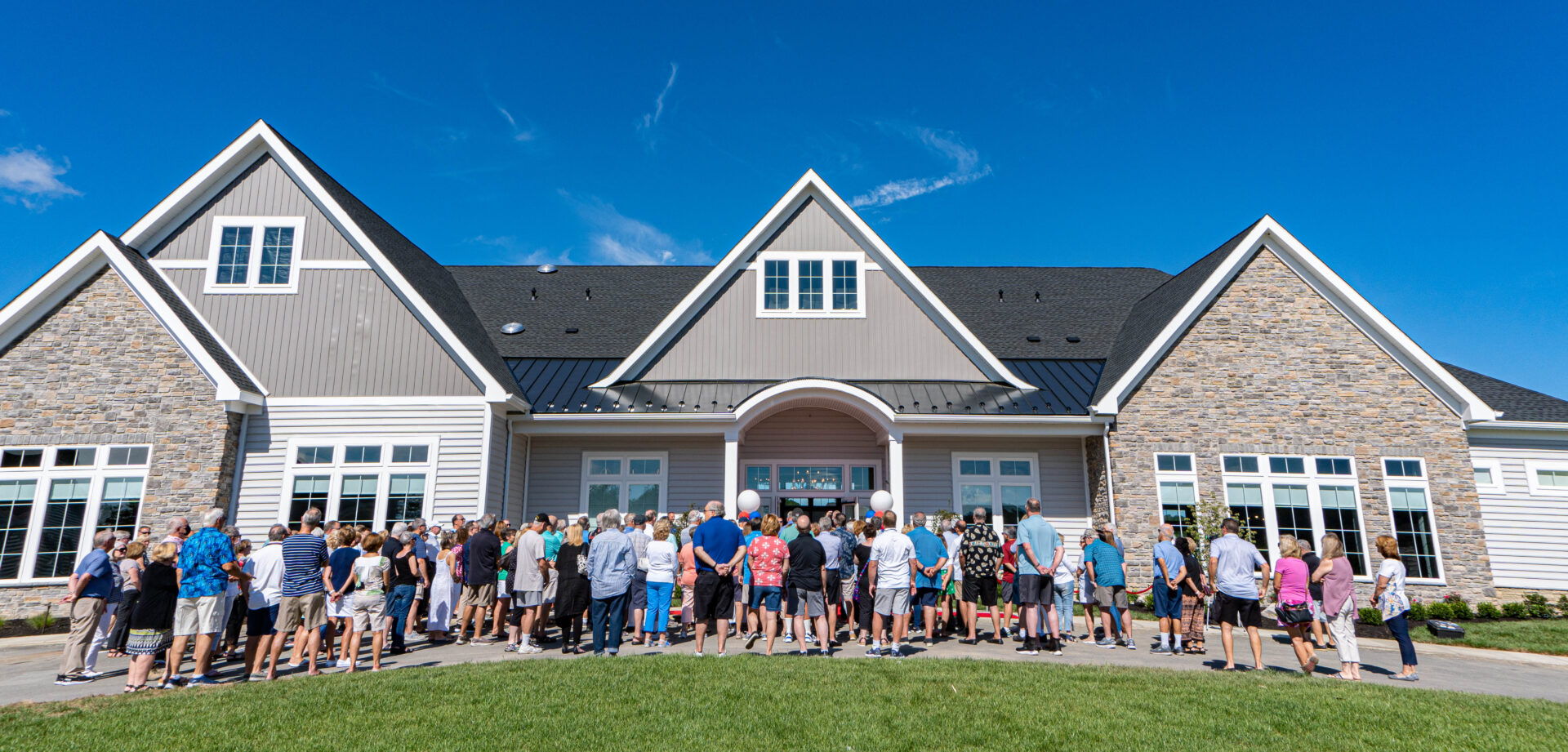 People standing out front of the Southpointe community clubhouse