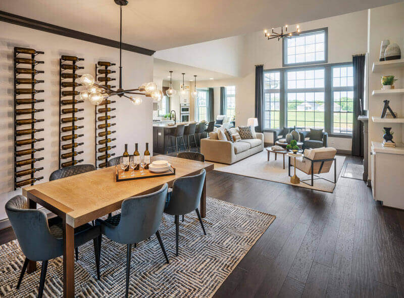 The dining area with a table and chandelier and Living room of The Franklin Model